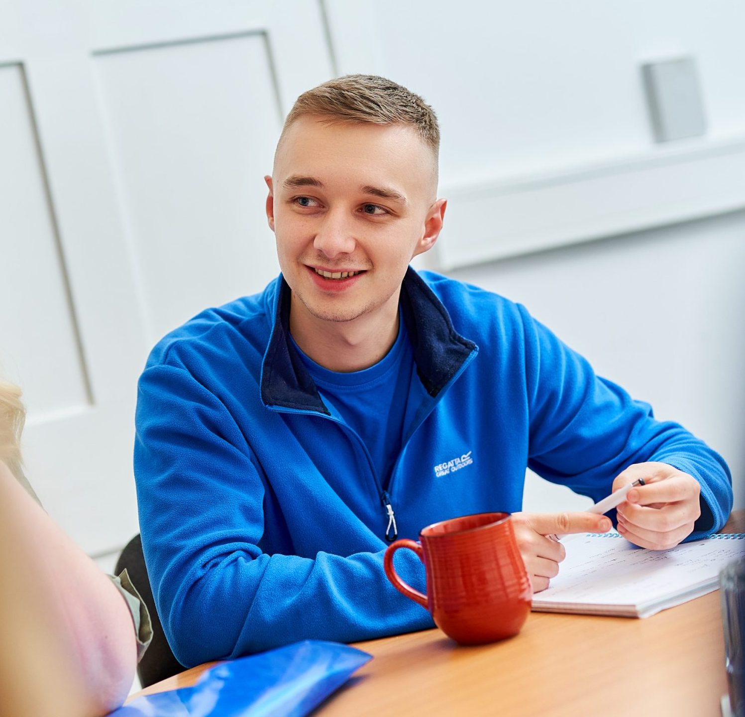 Smiling client at desk